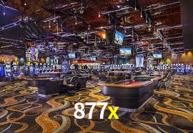 877x